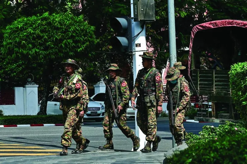 
Members of the Myanmar military security force patrol a street during a “silent strike” to protest and to mark the third anniversary of the military coup in Yangon on Thursday. 