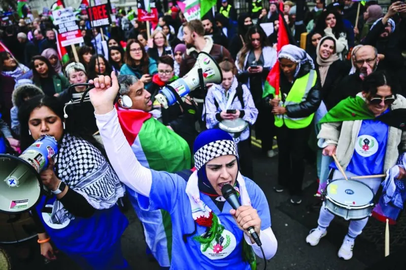 A Pro-Palestinian supporter chants slogans as she takes part in a &#039;National March for Palestine&#039; in central London on Saturday.