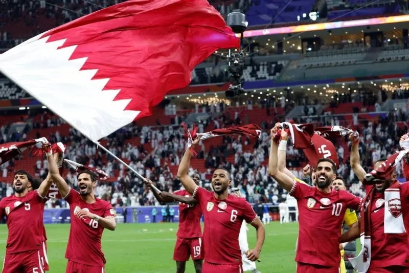 Qatar&#039;s players celebrate their win in the Qatar 2023 AFC Asian Cup quarter-final football match between Qatar and Uzbekistan at Al-Bayt Stadium. AFP