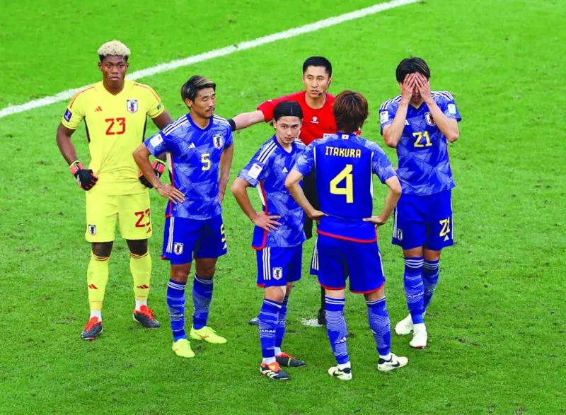 
A dejected Japan players after their loss to Iran in the quarter-finals. (Reuters) 
