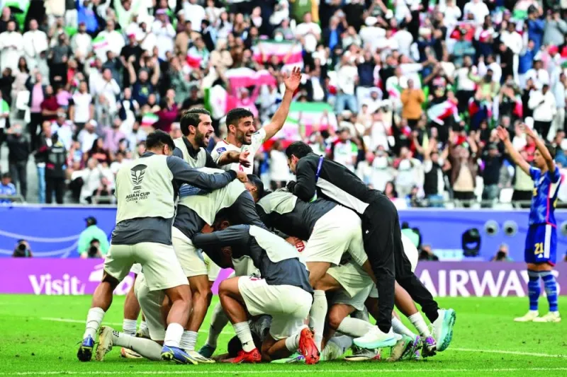 
Iran’s players celebrate after Alireza Jahanbakhsh’s winning penalty. 