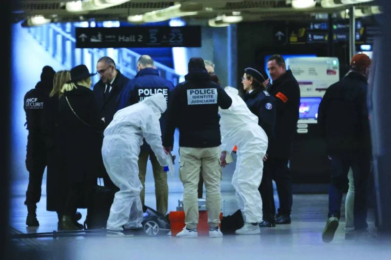 
French forensic and judicial police work after a knife attack at Paris’s Gare de Lyon railway station yesterday. (AFP) 