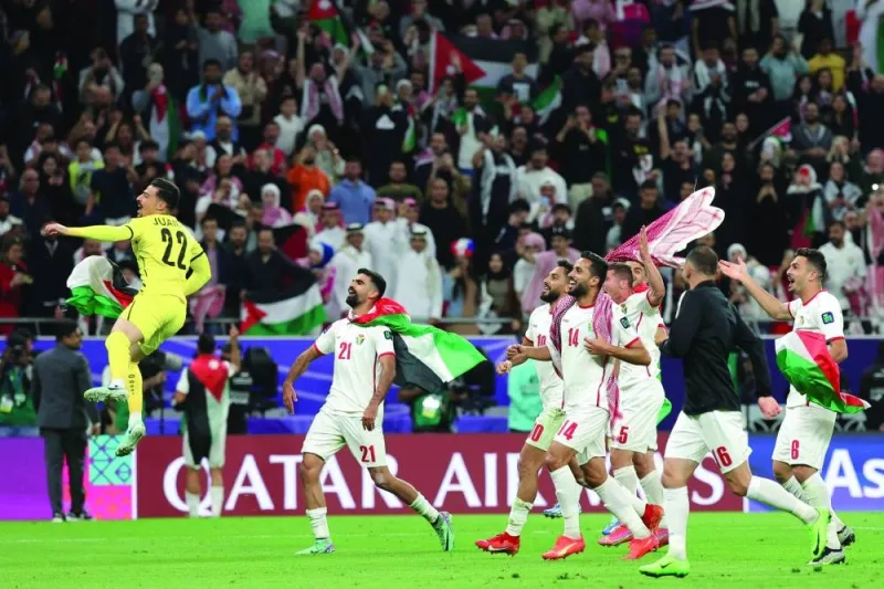 
Jordan’s players celebrate after their win over South Korea in the semi-final of the AFC Asian Cup at the Ahmad Bin Ali Stadium. (AFP) 