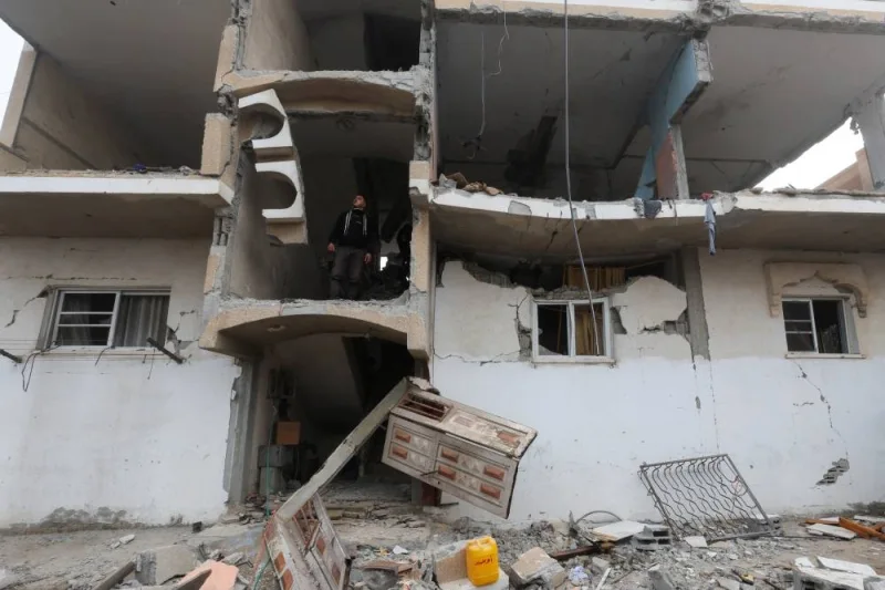 A Palestinian man inspects the site of an Israeli strike on a house in Rafah on Friday. REUTERS