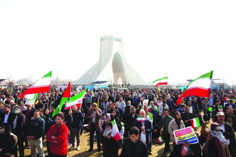 Iranians attend the 45th anniversary of the revolution in Tehran, yesterday.