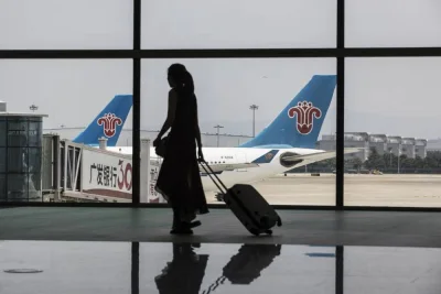 A woman carrying luggage is silhouetted as she walks past aircraft operated by China Southern Airlines sitting on the tarmac at Terminal 2 of the Guangzhou Baiyun International Airport in China (file). The Asia-Pacific region&#039;s significance in the future growth of the aviation industry is driven by its economic dynamism, large population, expanding middle class, infrastructure development, and its role as a key hub for international air travel.