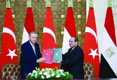 Turkiye's President Recep Tayyip Erdogan and Egypt's President Abdel Fattah al-Sisi attend a signing ceremony in Cairo, yesterday.