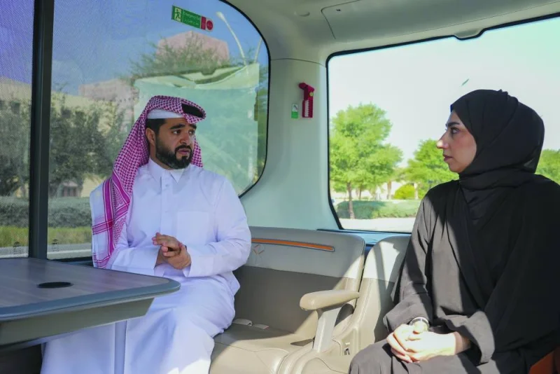 Ahmed al-Binali and Najla al-Jaber ride the e-Bus at Education City yesterday. PICTURES: Thajudheen