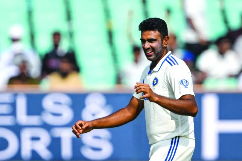 India’s Ravichandran Ashwin celebrates after taking the wicket of England’s Zak Crawley, his 500th Test wicket, during the second day of the third Test in Rajkot on Friday. Ashwin has become just the ninth bowler to make the feat. (AFP)