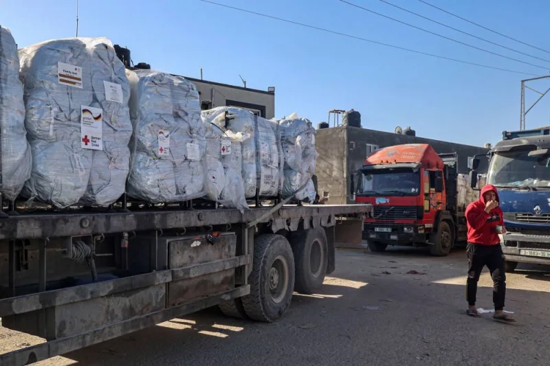 Humanitarian aid from the German Red Cross that entered Gaza by truck through the Kerem Shalom (Karm Abu Salem) border crossing in the southern part of the Palestinian territory on Saturday, waits to be unloaded in Rafah on the southern Gaza Strip. AFP