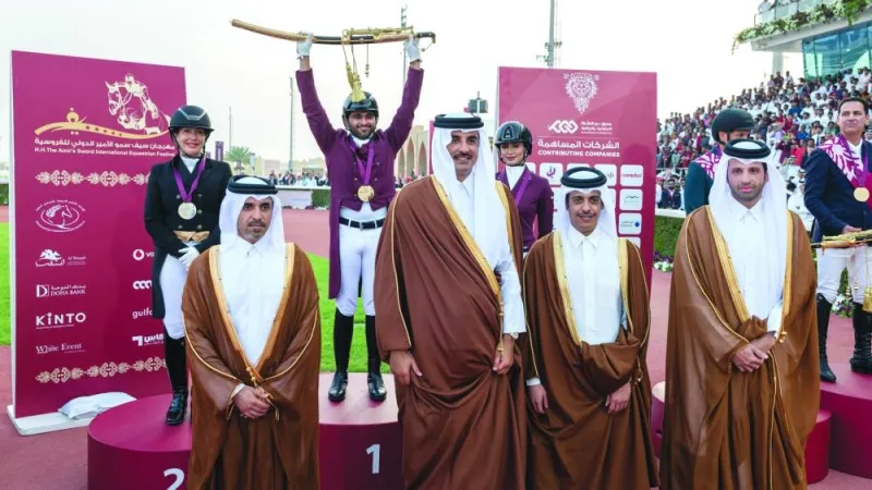 
His Highness the Amir Sheikh Tamim bin Hamad al-Thani poses with the podium finishers of HH The Amir Sword dressage competition. Qatar’s Jassim Mohamed al-Kuwari won the prestigious Amir Sword, while New Zealand’s Michelle Grimes finished second, Asmaa Yasser Mohamed took third spot. Badr bin Mohamed al-Darwish, President of the Qatar Equestrian Federation, and Sheikh Ahmed bin Noah al-Thani, Chairman of the Organising Committee of HH The Amir Equestrian Sword Festival are also seen in the picture. 