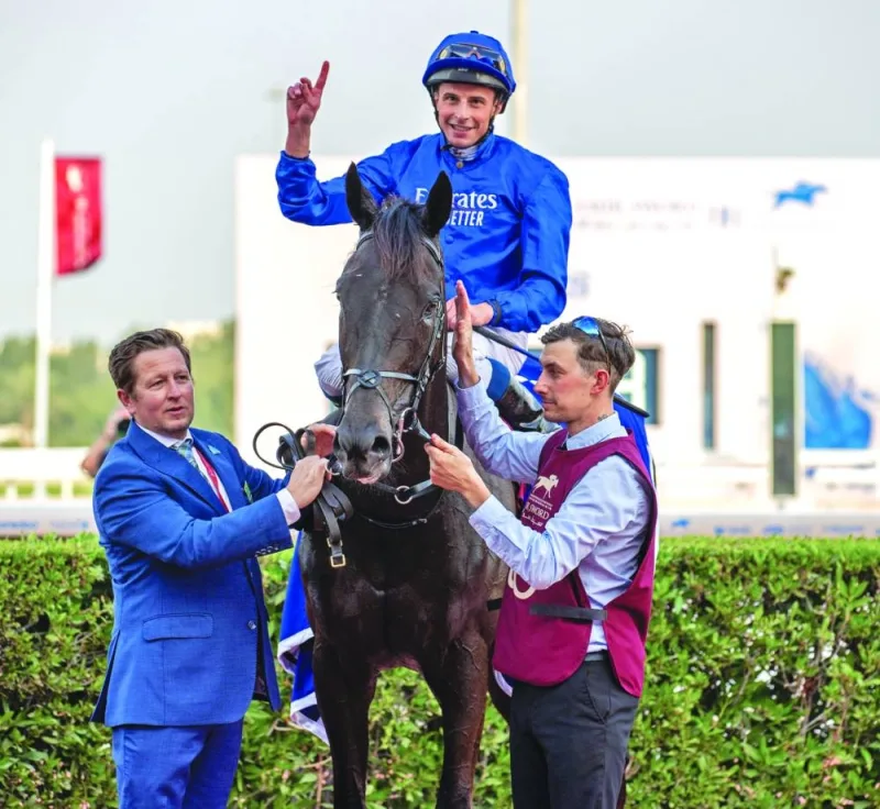 Jockey William Buick flashes a victory sign after leading Rebel’s Romance to HH The Amir Trophy win on Saturday.