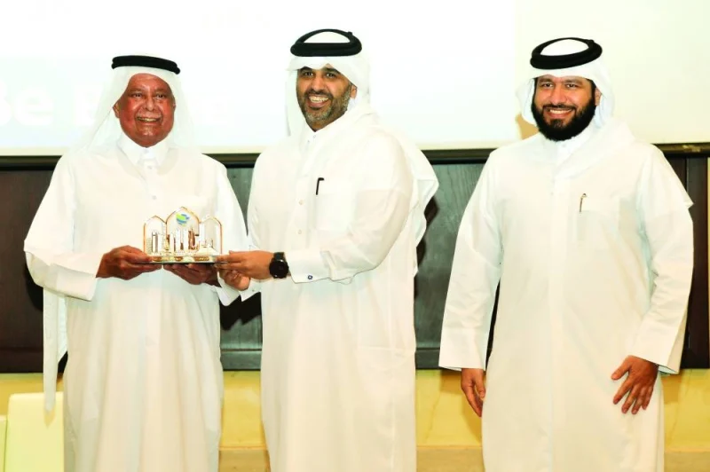 HE Abdullah bin Hamad al-Attiyah with HE Abdulaziz bin Nasser bin Mubarak al-Khalifa and Adel al-Hashimi.