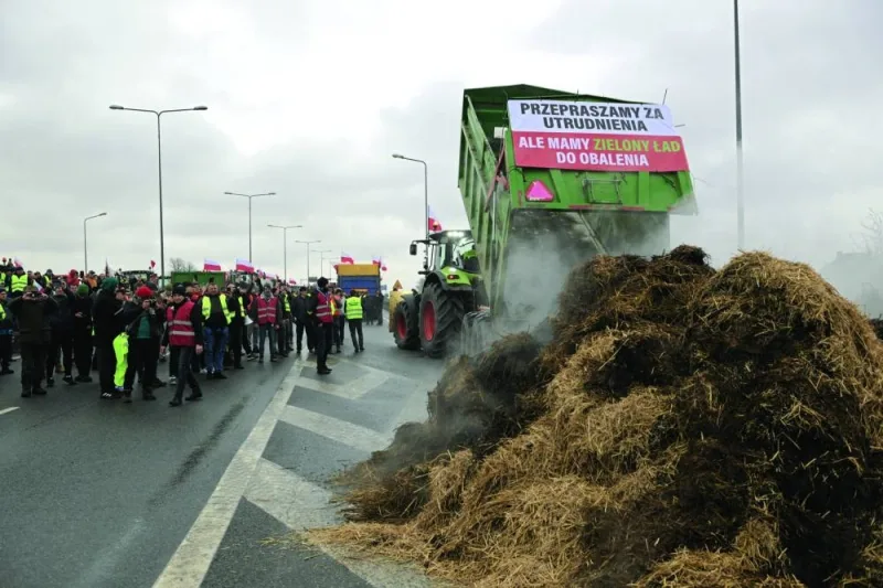 Polish farmers protest over grievances shared by farmers across Europe as they block roads in Elblag, Poland.