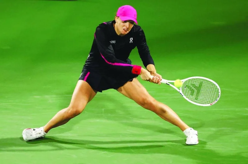 Poland’s Iga Swiatek in action during her Dubai Open quarter-final match against China’s Qinwen Zheng on Thursday. (Reuters)