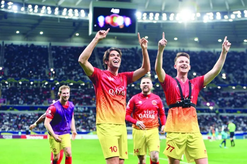 Kaka and other players celebrate during the match.
