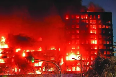This picture taken on Thursday night shows the huge fire raging through a multi-storey residential block in Valencia.