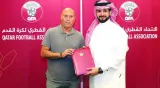Marquez Lopez poses with Qatar Football Association General Secretary Mansoor al-Ansari after signing the contract on Friday.