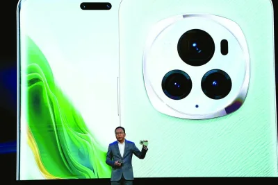 
George Zhao, Chief Executive Officer of Chinese consumer electronics brand Honor, presents the new Honor Magic 6 Pro smartphones on the eve of the Mobile World Congress (MWC), the telecom industry’s biggest annual gathering, in Barcelona on Sunday. 