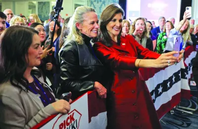 
Haley takes a selfie with her supporter at her watch party during the South Carolina Republican presidential primary election in Charleston. 