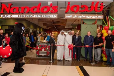 Cutting the ribbon, Jassim Al-Kuwari, Chairman and Yacoub Boutros, Managing Director of Tawar Mall; John Sikiotis, CEO of Nando’s Licensed Markets & India; and Sajed Sulaiman, Managing Director of Oryx Group for Food Services, joined by CEO C V Rappai and South African Ambassador His Excellency, Mr. Ghulam Hoosein Asmal) 