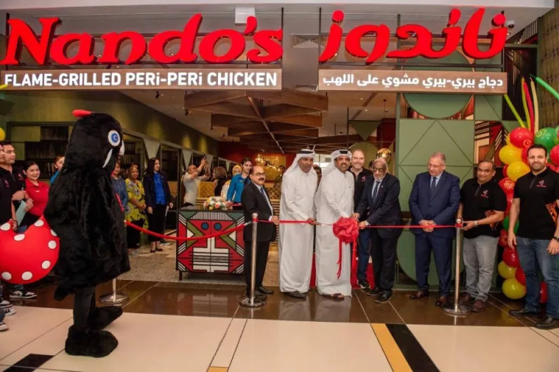 Cutting the ribbon, Jassim Al-Kuwari, Chairman and Yacoub Boutros, Managing Director of Tawar Mall; John Sikiotis, CEO of Nando’s Licensed Markets & India; and Sajed Sulaiman, Managing Director of Oryx Group for Food Services, joined by CEO C V Rappai and South African Ambassador His Excellency, Mr. Ghulam Hoosein Asmal) 