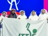 
President of the Qatar Table Tennis Association (QTTA) Khalil al-Mohannadi waves the flag to signify Doha hosting 2025 ITTF World Table Tennis Championships in Busan, South Korea. Right: Khalil al-Mohannadi is joined by Secretary-General of QTTA Mohamed Abdullah Saleh, Assistant Secretary-General Ali Sultan al-Muftah, and Abdullah al-Mulla, a member of the 
Association’s Board of Directors, at the ITTF gathering in Busan.
 
