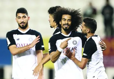Al Sadd striker Akram Afif celebrates with his teammates one of his three goals against Qatar SC during their Expo Stars League clash at Jassim Bin Hamad Stadium in Doha on Friday. Al Sadd won 3-0.