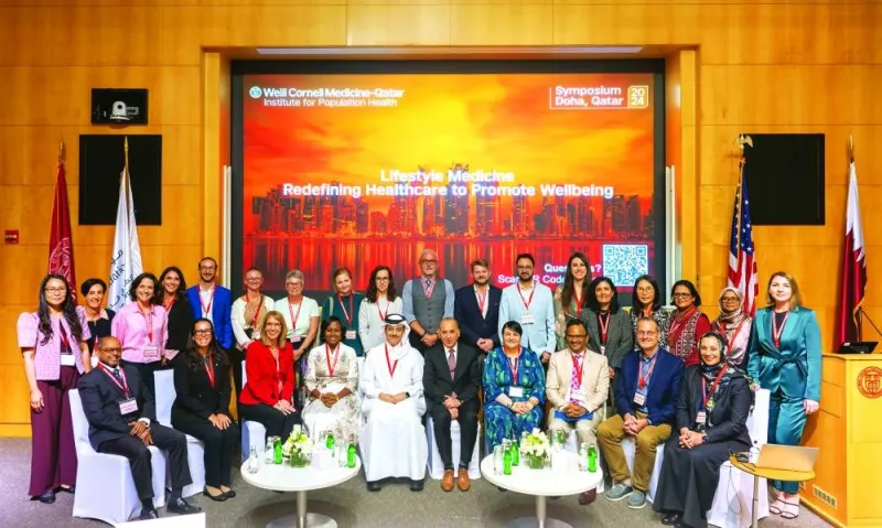 Sheikh Dr Mohamed bin Hamad  al-Thani (fifth left-front row) and Dr Ravinder Mamtani (fifth right-front row), and other participants at the event.