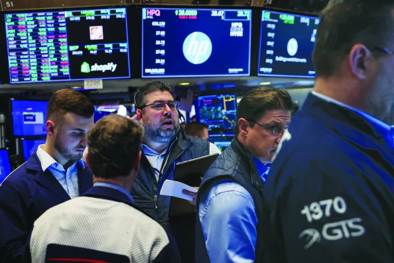 
Traders work on the floor at the New York Stock Exchange. As fervour for artificial intelligence sweeps Wall Street, some investors are seeking bargains in more conventional areas of the stock market. 