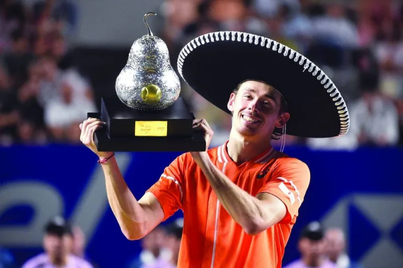 
Australia’s Alex De Minaur celebrates with his trophy after winning Mexico Open at the Arena GNP Seguros in Acapulco, Mexico. (AFP) 