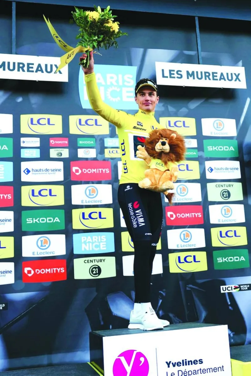 Team Visma-Lease a Bike&#039;s Dutch cyclist Olav Kooij celebrates on the podium after winning the 1st stage of the Paris-Nice cycling race, 158 km between Les Mureaux and Les Mureaux, on March 3, 2024. (AFP/File photo)