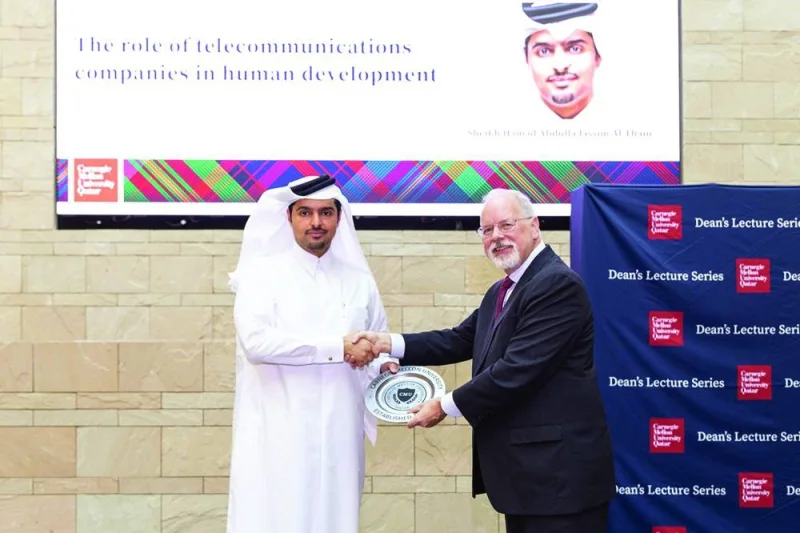 Vodafone Qatar CEO Sheikh Hamad Abdulla Jassim al-Thani receiving a token of recognition from CMU-Q dean Michael Trick during the latest instalment of the university&#039;s Dean’s Lecture Series.
