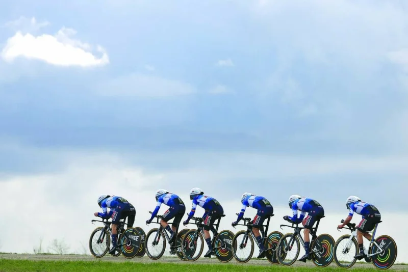 Soudal Quickstep’s team competes during the 3rd stage of the Paris-Nice cycling race, covering a distance of 26.9kms team time trial between Auxerre and Auxerre, on Tuesday. (AFP)
