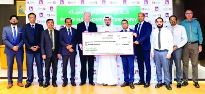 LuLu Group Qatar regional manager Shanavas Padiyath led the official handover of a cheque worth QR100,000 to QSRSN Public Relations co-ordinator Dheyaa Khaled Alshmare.