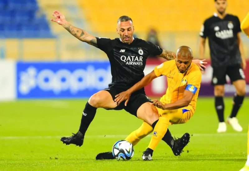 
Al Gharafa’s Yacine Brahimi (right) and Al Sadd’s Guilherme Torres battle for the ball during the Expo Stars League at the Thani Bin Jassim Stadium yesterday. 