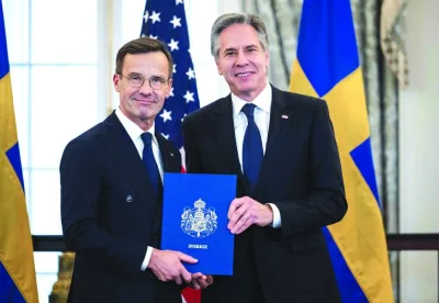 
US Secretary of State Antony Blinken receives the Nato ratification documents from Swedish Prime Minister Ulf Kristersson during a ceremony at the US State Department. 