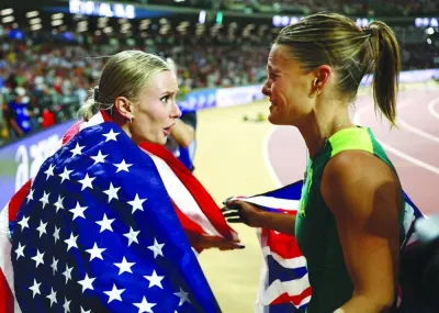
Australia’s Nina Kennedy and Katie Moon of the US celebrate after sharing the gold in the women’s pole vault at the World Athletics Championships on August 24, 2023, in Budapest. (Reuters) 
