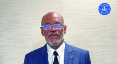 
Haiti’s Prime Minister Ariel Henry speaks while addressing the nation at an unidentified location on a date given as March 11, 2024 in this screengrab obtained from a handout video.  (Reuters) 