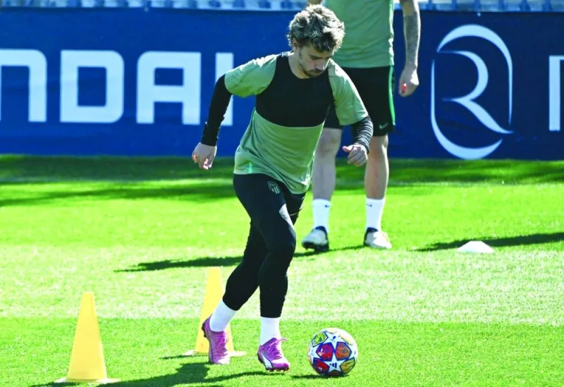 Atletico Madrid’s Antoine Griezmann attends a training session on Tuesday, on the eve of their Champions League last 16 second leg match against Inter Milan in Madrid. (AFP)