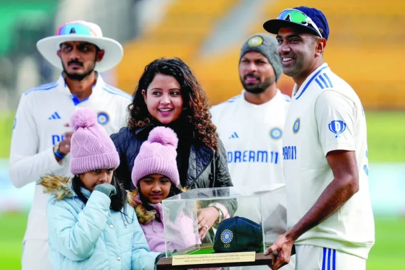 India’s Ravichandran Ashwin with his family after receiving his 100th Test cap in Dharamsala on March 7.