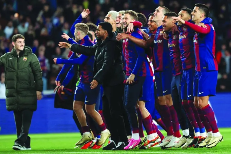 
Barcelona players celebrate their win in the Champions League last 16 second leg match against Napoli in Barcelona. (AFP) 