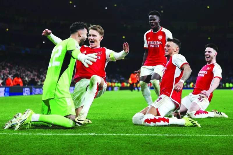 
FROM LEFT: Arsenal’s goalkeeper David Raya, Martin Odegaard, Bukayo Saka, Ben White and Declan Rice celebrate after winning the penalty shoot-out during the UEFA Champions League last 16 second leg match against Porto FC at the Arsenal Stadium in London. (AFP) 