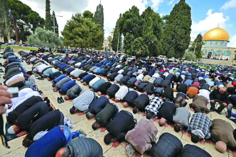 Muslims devotees offer first Friday prayers of the holy fasting month of Ramadan at the compound of the Al-Aqsa Mosque in the Old City of Jerusalem.