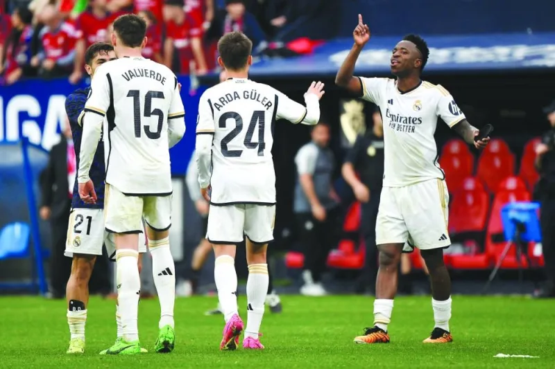 
Real Madrid’s Vinicius Junior (right) celebrates with teammates after the victory against Osasuna at El Sadar stadium in Pamplona, Spain, yesterday. (AFP) 