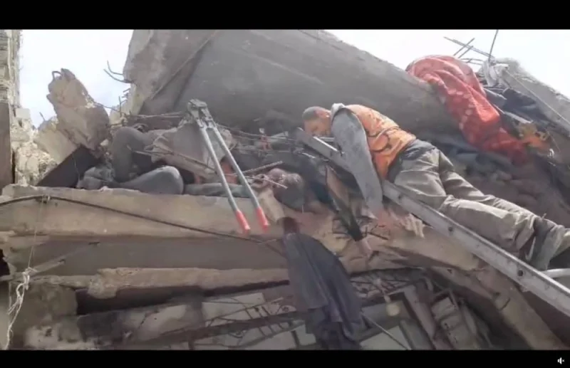 Workers search for casualties among rubble in Gaza City, in this screengrab from a video released on Saturday.  Palestinian Civil Defence/Handout via REUTERS