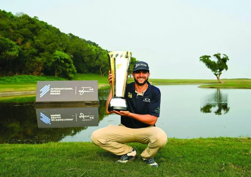 John Catlin of the US posing with the trophy after the final round of the International Series Macau at the Macau Golf and Country Club. (AFP)