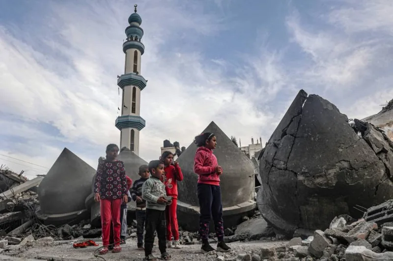 Children stand next to the rubble of Al-Faruq Mosque, that was destroyed during Israeli bombardment, in Rafah on the southern Gaza Strip on Sunday. AFP