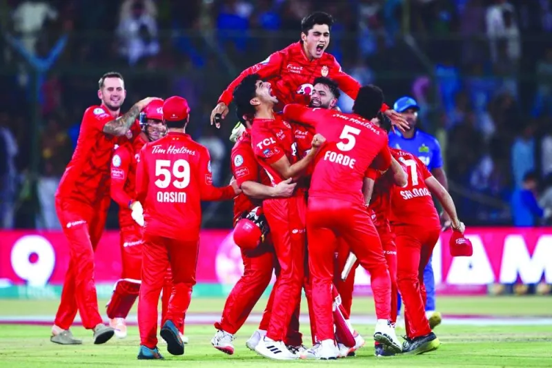 Islamabad United’s players celebrate their victory over Multan Sultans in the PSL final on Tuesday. (AFP)