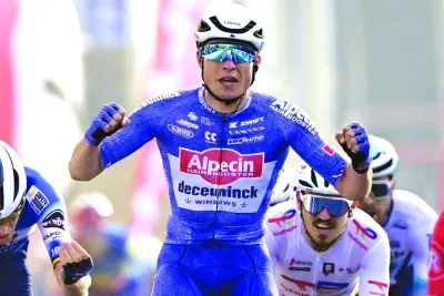 Alpecin-Deceuninck’s Belgian rider Jasper Philipsen reacts as he crosses the finish line to win the ‘Classic Brugge-De Panne’ men’s elite one-day cycling race, 198.9km from Brugge to De Panne on Wednesday. (AFP)